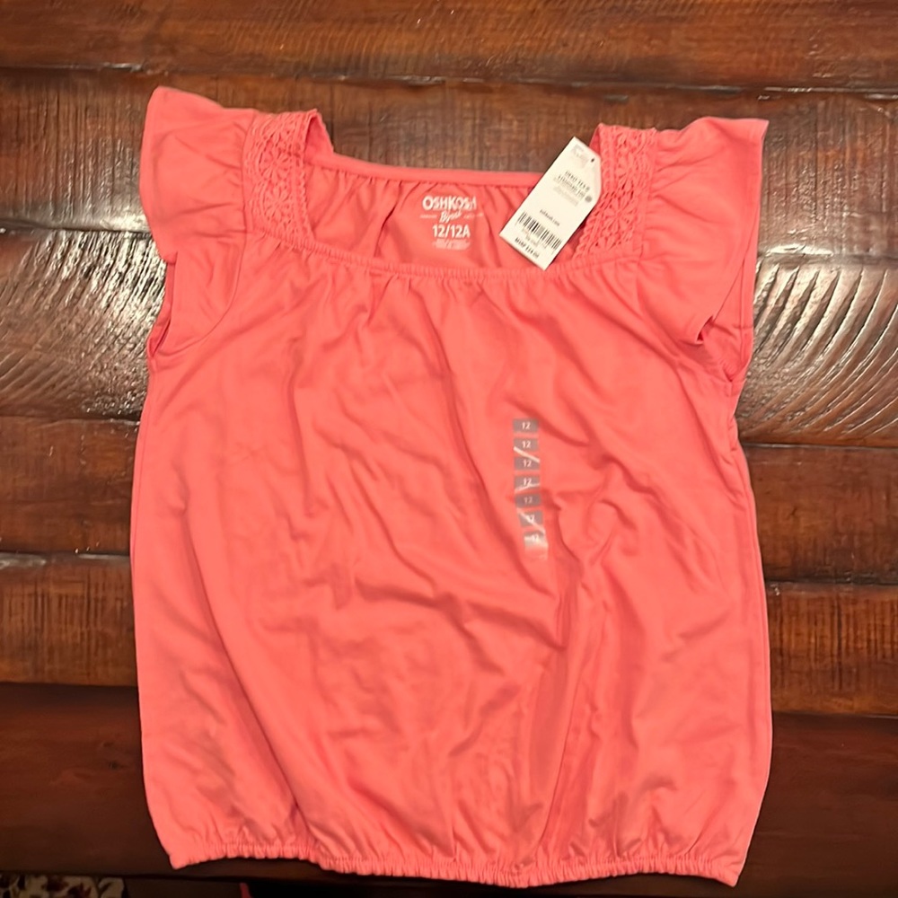 New with tags salmon colored cap sleeve size 12 Oshkosh shirt. Smoke free home.